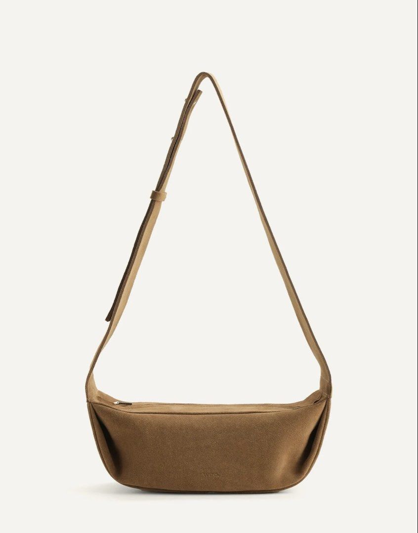 Waa Studios Baa Bag in Taupe Suede (Category: Cross-body Bags) located in Paranaque City. Submitted by izdeclutters (Listing ID 1466180520, Image 1). Description: TAUPE COCOA WASHED | SUEDE Shell: Cowhide Suede, Lining: 100% Cotton Concealed metal zip closure Adjustable strap length: 85-100 cm Height: 11 cm, Width: 29.5 cm, Depth: 10 cm Original price 159 USD .