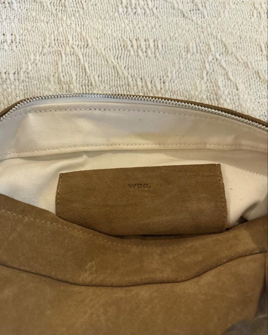 Waa Studios Baa Bag in Taupe Suede (Category: Cross-body Bags) located in Paranaque City. Submitted by izdeclutters (Listing ID 1466180520, Image 3). Description: TAUPE COCOA WASHED | SUEDE Shell: Cowhide Suede, Lining: 100% Cotton Concealed metal zip closure Adjustable strap length: 85-100 cm Height: 11 cm, Width: 29.5 cm, Depth: 10 cm Original price 159 USD .