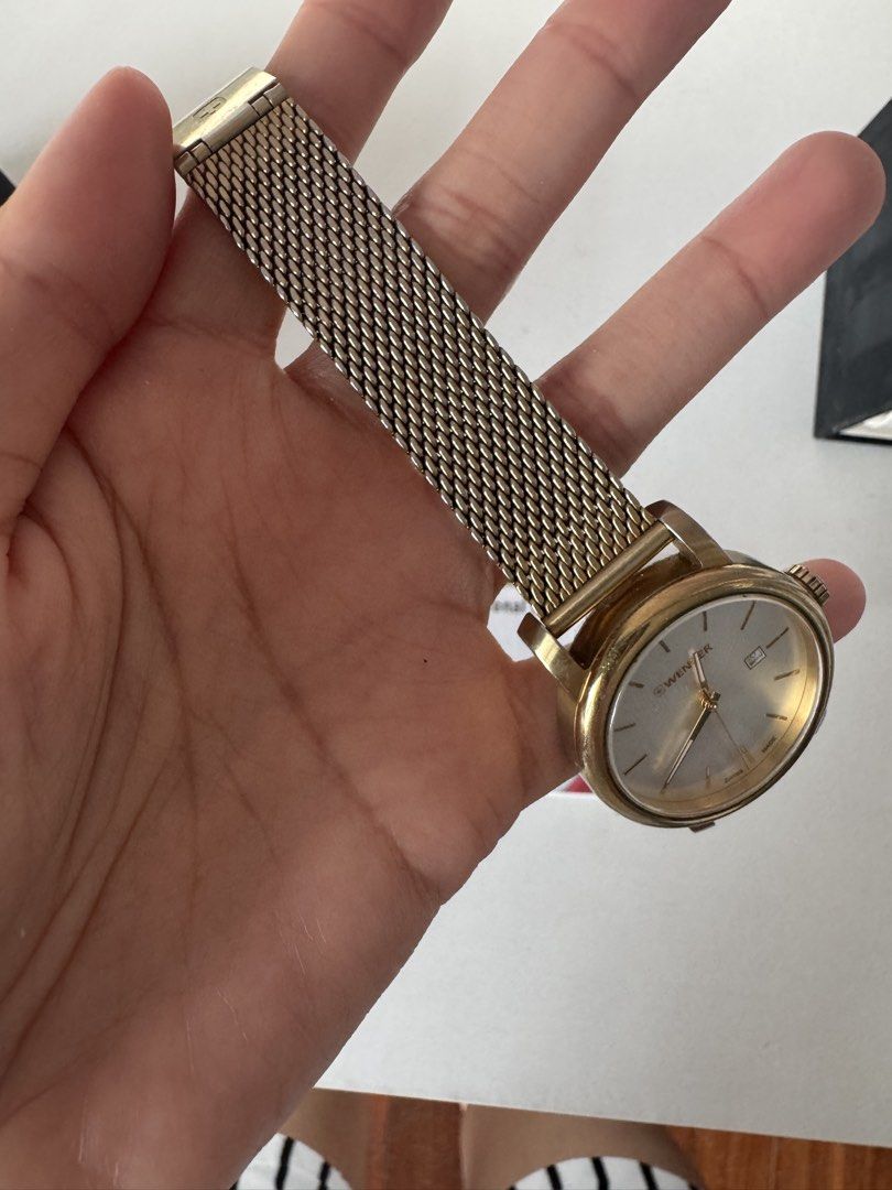 Wenger Gold-Tone Mesh Watch with Box (Category: Women's Watches) located in Davao. Submitted by rctongco7762375 (Listing ID 1466178782, Image 3). Description: • Model: Urban Classic Lady (01.1021.118) • Movement: Swiss Quartz (Battery-powered) • Case Size: 34mm • Inclusions: Comes with the original instructions booklet, service center guide, and the original stamped purchase paper. ⚠️ Honest Condition Note: This is a pre-loved vintage piece from 
