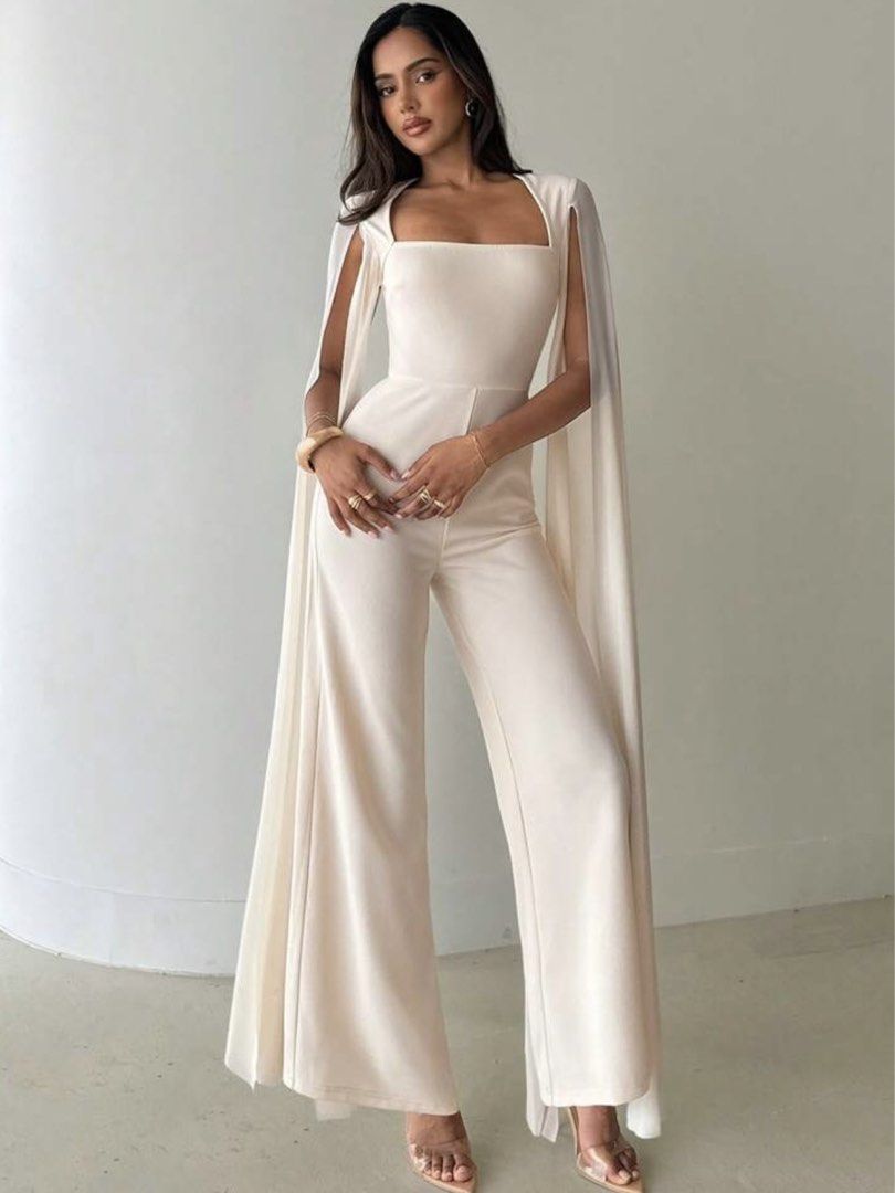 White Cape Jumpsuit (Category: Jumpsuits) located in Quezon City. Submitted by jo216 (Listing ID 1466256951, Image 2). Description: Square neckline, fitted bodice, wide-leg trousers, and dramatic floor-length split capes - Condition: Wore once for an event, freshly dry-cleaned, and ready for a new owner - Fit: True to size.
