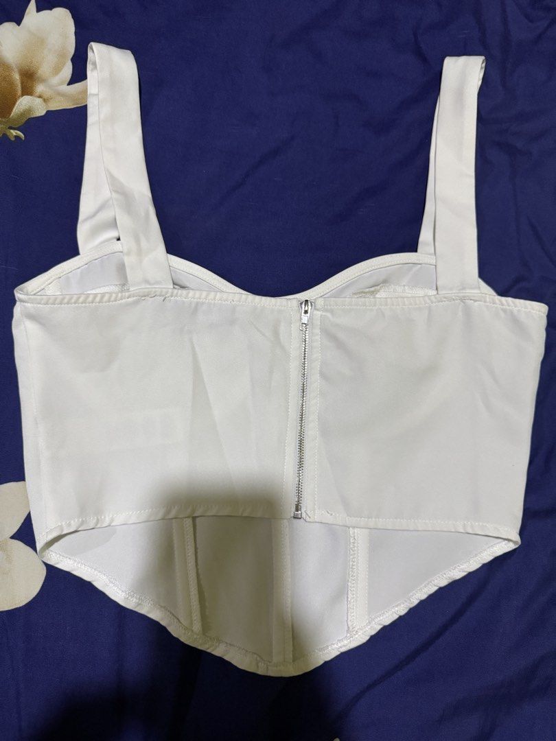 White Corset Top (Category: Sleeveless) located in Imus. Submitted by therealmf (Listing ID 1466333630, Image 2). Description: - this was bought from tiktok live - i never used it coz i don't like thick strap - negotiable pa just hit me up!.