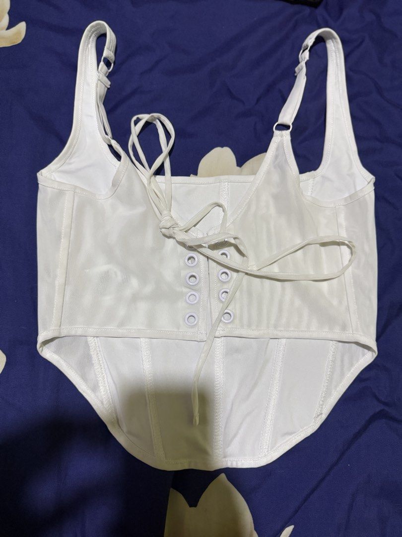 White Corset Top (Category: Sleeveless) located in Imus. Submitted by therealmf (Listing ID 1466333903, Image 2). Description: - this was bought from tiktok live - used it once nung bday ko lang - it says xl but it fits me since im medium - the back is adjustable because di tali sya - negotiable pa just hit me up!.