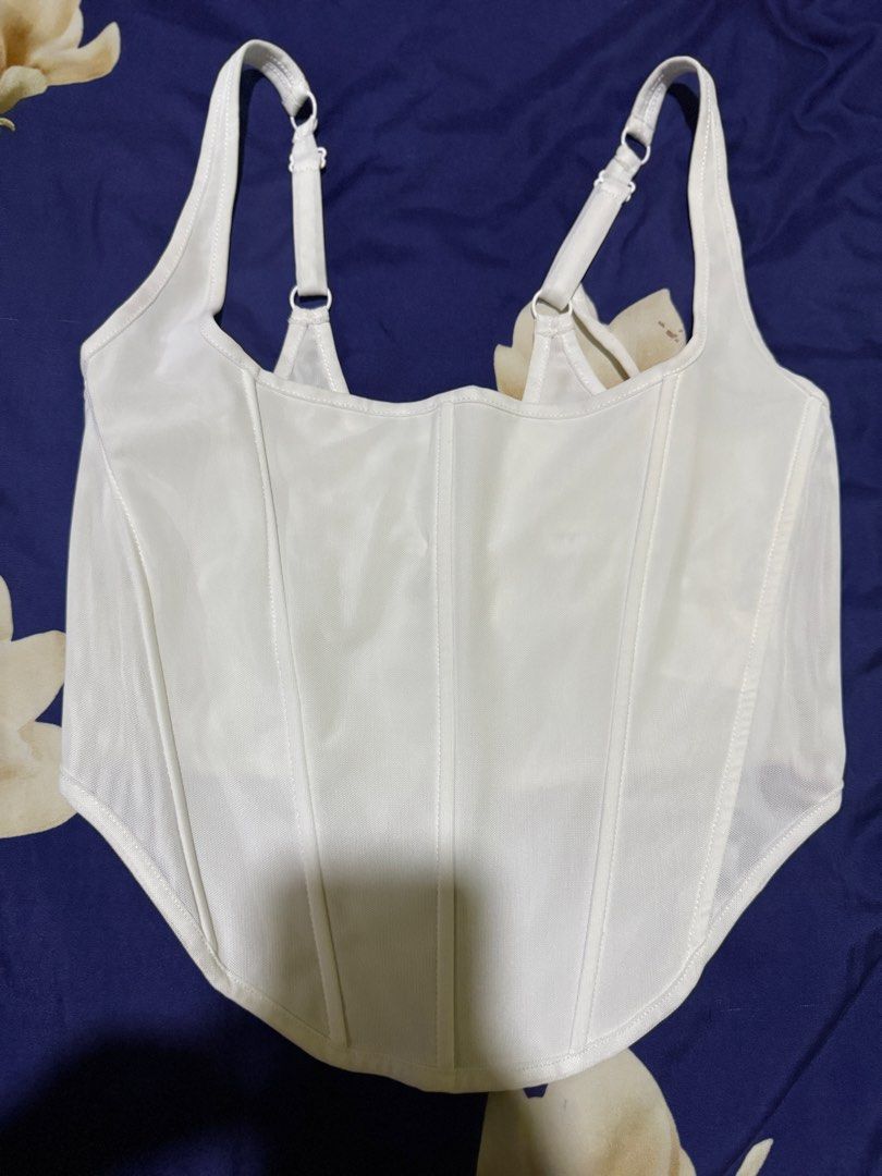 White Corset Top (Category: Sleeveless) located in Imus. Submitted by therealmf (Listing ID 1466333903, Image 1). Description: - this was bought from tiktok live - used it once nung bday ko lang - it says xl but it fits me since im medium - the back is adjustable because di tali sya - negotiable pa just hit me up!.
