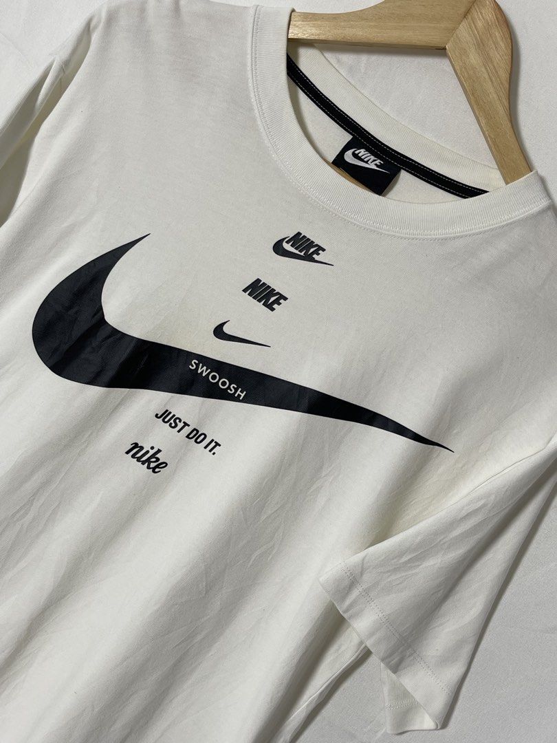White Nike Just Do It Graphic Sport Shirt (Category: Tshirts & Polo Shirts ) located in Imus. Submitted by mochi.rella (Listing ID 1466330708, Image 2). Description: White NK Just Do It Good Condition S on tag | Fit M W 20 | L 24 .