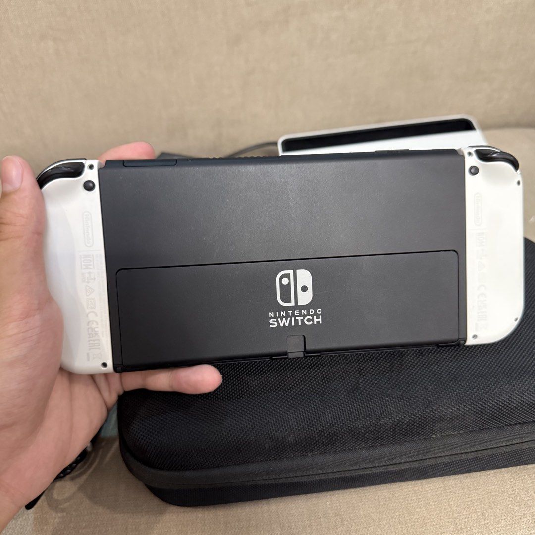 White Nintendo Switch Oled for Sale (Category: Nintendo) located in Pasig City. Submitted by mikollol (Listing ID 1466163818, Image 3). Description: White Nintendo Switch OLED WITH FREEBIES - Like new condition and no issues - 10,000 php fix price - Lost Original Box 📍Manila (weekdays) 📍 Pasig (weekends) Inclusions: ✅ White Nintendo Switch w/ tempered glass ✅ Original Box ✅ Charger ✅ Joy-Con (L&R) ✅ Joy-Con Straps ✅ Joy-Con Grip ✅ HDMI Cable ✅ 