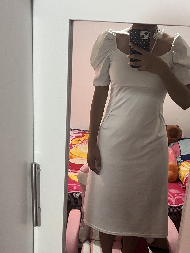 White Puff Sleeve Square Neck Maxi Dress (Category: Dresses) located in Manila. Submitted by chimcheese (Listing ID 1461584499, Image 3). Description: - Stunning white maxi dress - Features elegant puff sleeves - Flattering square neckline - Fabric has a subtle, luxurious sheen - Delicate butterfly detail on the neckline strap - Ideal for formal events, photoshoots, or special occasions - Simple yet sophisticated design.