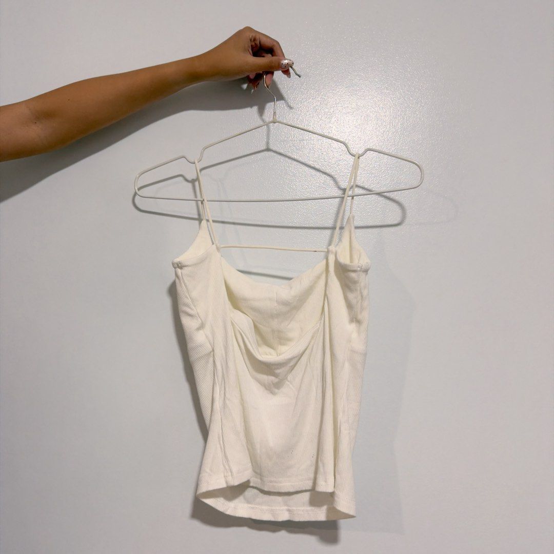 white ribbed backless top (Category: Sleeveless) located in Cebu City. Submitted by cuteoncue (Listing ID 1466202006, Image 3). Description: small-med (large on tag, runs small) please see the last photos for the barely visible tiny black paint marks. the item was freshly laundered but not soaked or stain-treated..