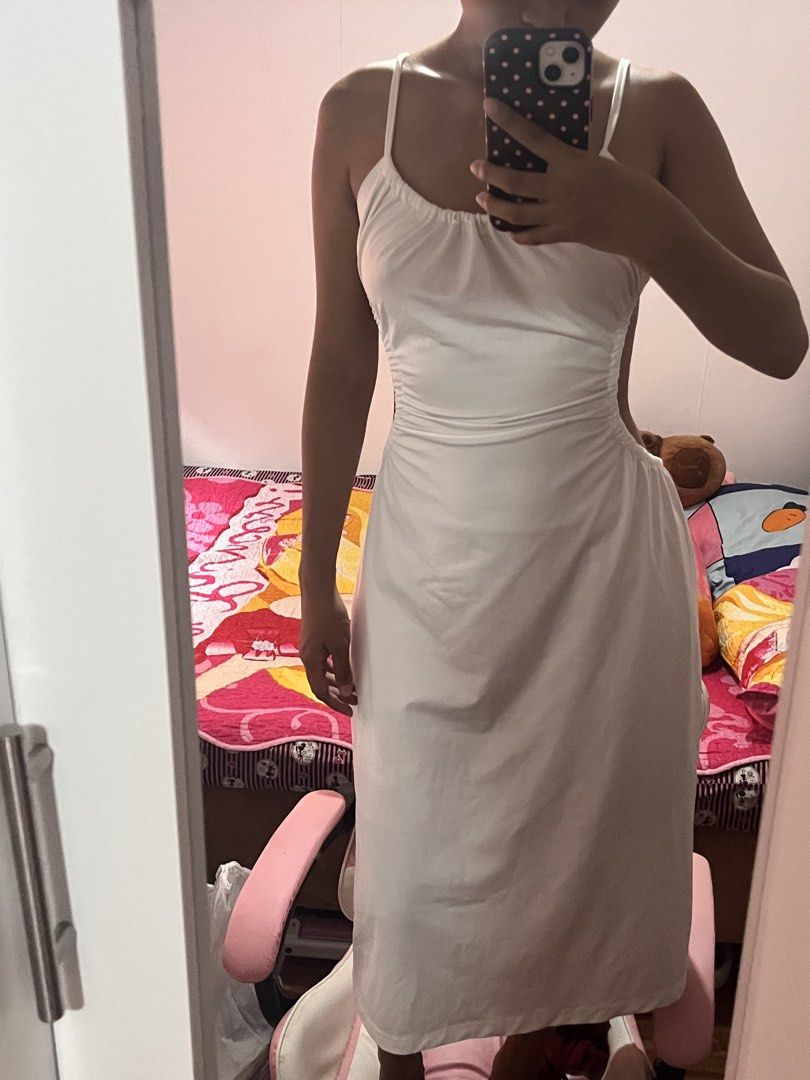 White Ruched Side Spaghetti Strap Maxi Dress (Category: Dresses) located in Manila. Submitted by chimcheese (Listing ID 1461328668, Image 2). Description: - Flowy white maxi dress - Spaghetti straps - Ruched sides for a flattering fit - Tie-back detail - Lightweight and breathable fabric - Ideal for beach vacations or summer parties - Effortless to wear and style.