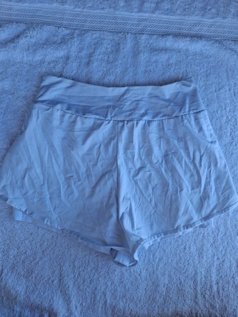UNDER ARMOUR FLY BY 2-IN-1 WHITE SHORT (Category: Activewear) located in Abucay. Submitted by petiteprettyboutiquev2 (Listing ID 1466171808, Image 2). Description: color rate white na white ito.. L in size but fits well to M Goods for running or pickleball with inner kasi and flowy + SF(J&T) Disclaimer : need wash may mga washable stains na stock din kasi ng matagal.