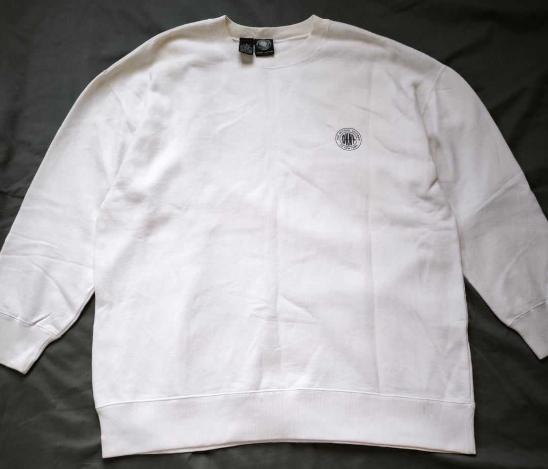 White sweater (DKNY) (Category: Coats, Jackets and Outerwear) located in Manila. Submitted by wearforce (Listing ID 1466302120, Image 1). Description: White sweater (DKNY) brand: DKNY in good condition can fit: S-M rate color 9/10 550 + sf.