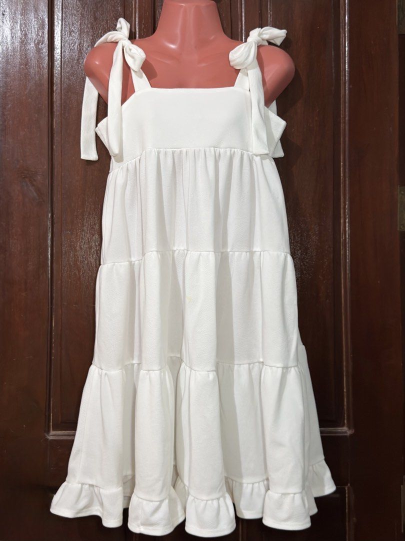 white tiered sundress with shoulder tie straps (Category: Dresses) located in Muntinlupa City. Submitted by aldscart (Listing ID 1466175652, Image 1). Description: • pre-loved 💌 • price is negotiable! • mop: bank transfer; mod: sdd, ggx send me a msg for inquiries! .