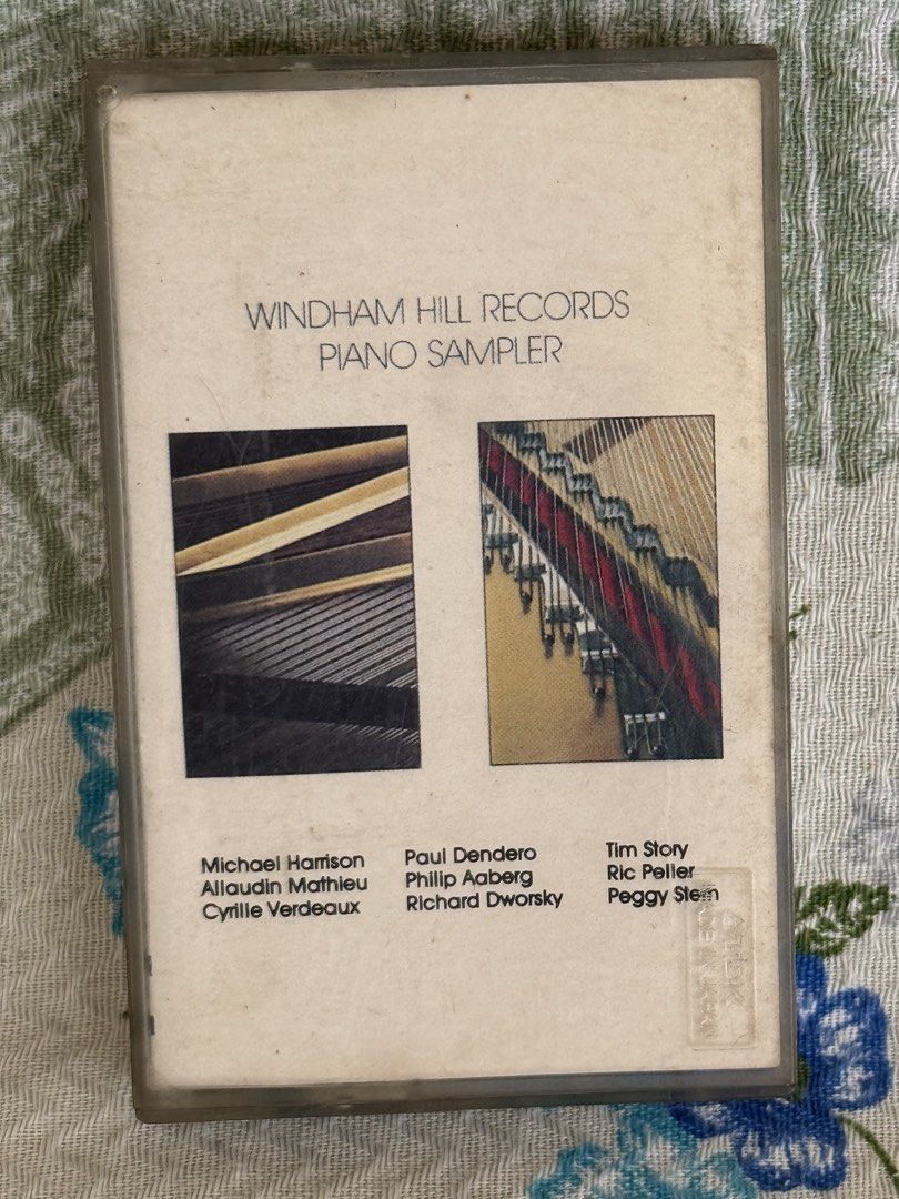 Windham Hill Records Piano Sampler Cassette Tape (Category: CDs & DVDs) located in San Juan City. Submitted by redgecollection (Listing ID 1466243991, Image 1). Description: - Item: Windham Hill Records Piano Sampler Cassette Tape - Features: Tracks by Michael Harrison, Philip Aaberg, Tim Story, and more - Pressing: AVI Records, manufactured in the Philippines by Dyna Products, Inc. - Inclusion: Original paper insert - Condition: Clear plastic ca