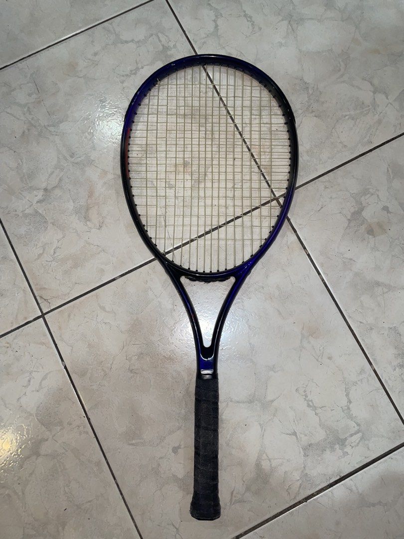 Winghart PROVARV Tennis Racket Japan (Category: Racket and Ball Sports) located in Del Monte. Submitted by aleckpo (Listing ID 1466187511, Image 1). Description: - Brand/Model: Winghart Provarv Tennis Racket - Design & Origin: Designed in Japan, Manufactured in Thailand - Color/Finish: Eye-catching blue sparkle finish - Specs: Recommended tension 50-55 lbs - Condition: Strung and ready to hit the court, wrapped with a brand-new black grip tape - 