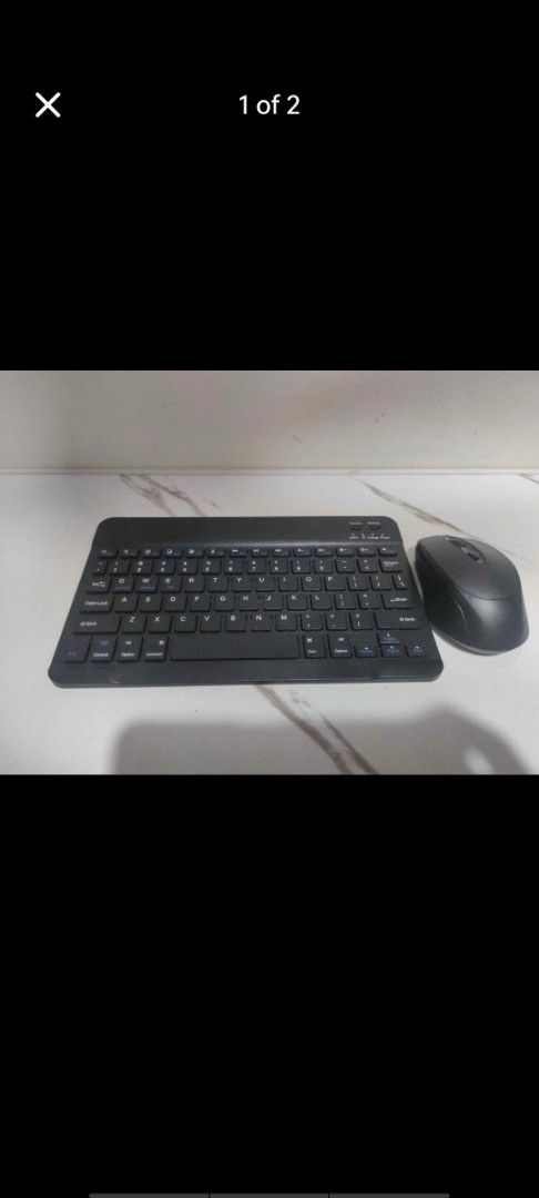 Wireless Bluetooth Keyboard and Dual-Mode Mouse Combo (Category: Computer Keyboard) located in Manila. Submitted by billythekid05 (Listing ID 1466284604, Image 1). Description: - Sleek all-black wireless keyboard and matching dual-mode mouse - Versatile connectivity with easy toggle for Bluetooth and 2.4G on the mouse - Compact, clean layout ideal for multi-device setups - Smooth performance with great battery retention - Perfect for WFH, office,