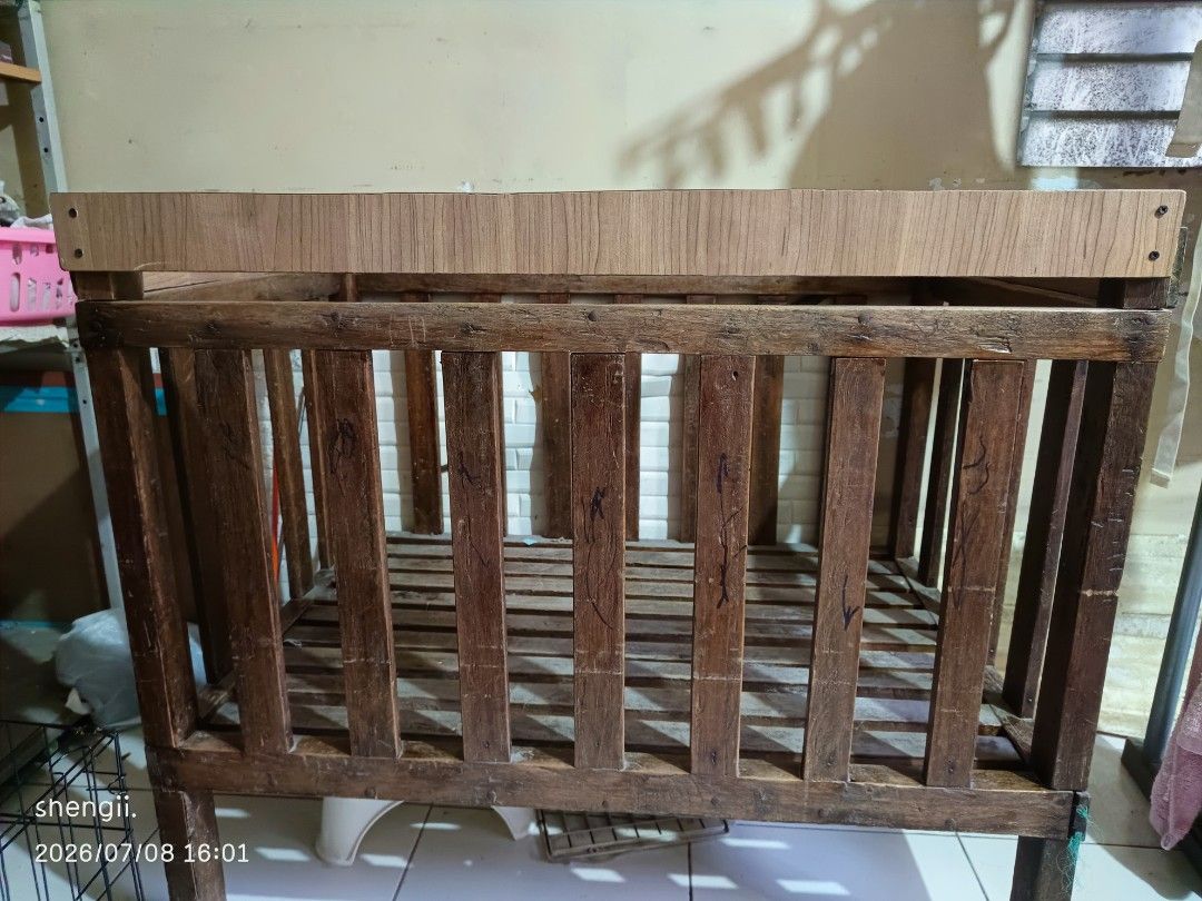 Wooden Baby Crib (Category: Cots & Cribs) located in Taguig. Submitted by shengii1234 (Listing ID 1466187242, Image 3). Description: WOODEN CRIB. Made of hard wood di ko na matandaan ang pangalan ng wood na ginamit but this one is customized. This has been with us for 16 years. Ganun sya katibay. Konting linis and varnish lang and like new na ulit sya kasi magandang kahoy ginamit. RFS: declutter kasi sayang sa space at malalaki na ang mga anak. W