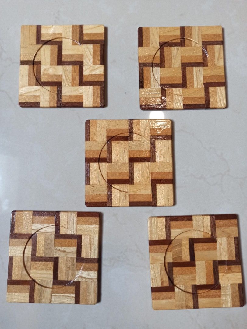Wooden hand made Coaster Set with Storage Box - Great looking coaster design (Category: Dinnerware & Cutlery) located in Caloocan City. Submitted by rtarellano (Listing ID 1466172000, Image 2). Description: - Set of 5 wooden square coasters (3.5 inches across) - Features an eye-catching geometric parquet pattern and recessed circle center - Elegant glossy finish suitable for hot and cold drinks - Comes with original fitted cardboard storage box f