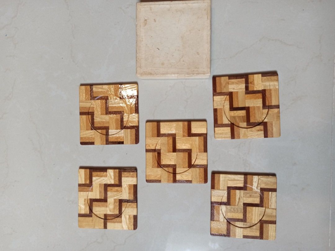 Wooden hand made Coaster Set with Storage Box - Great looking coaster design (Category: Dinnerware & Cutlery) located in Caloocan City. Submitted by rtarellano (Listing ID 1466172000, Image 3). Description: - Set of 5 wooden square coasters (3.5 inches across) - Features an eye-catching geometric parquet pattern and recessed circle center - Elegant glossy finish suitable for hot and cold drinks - Comes with original fitted cardboard storage box f