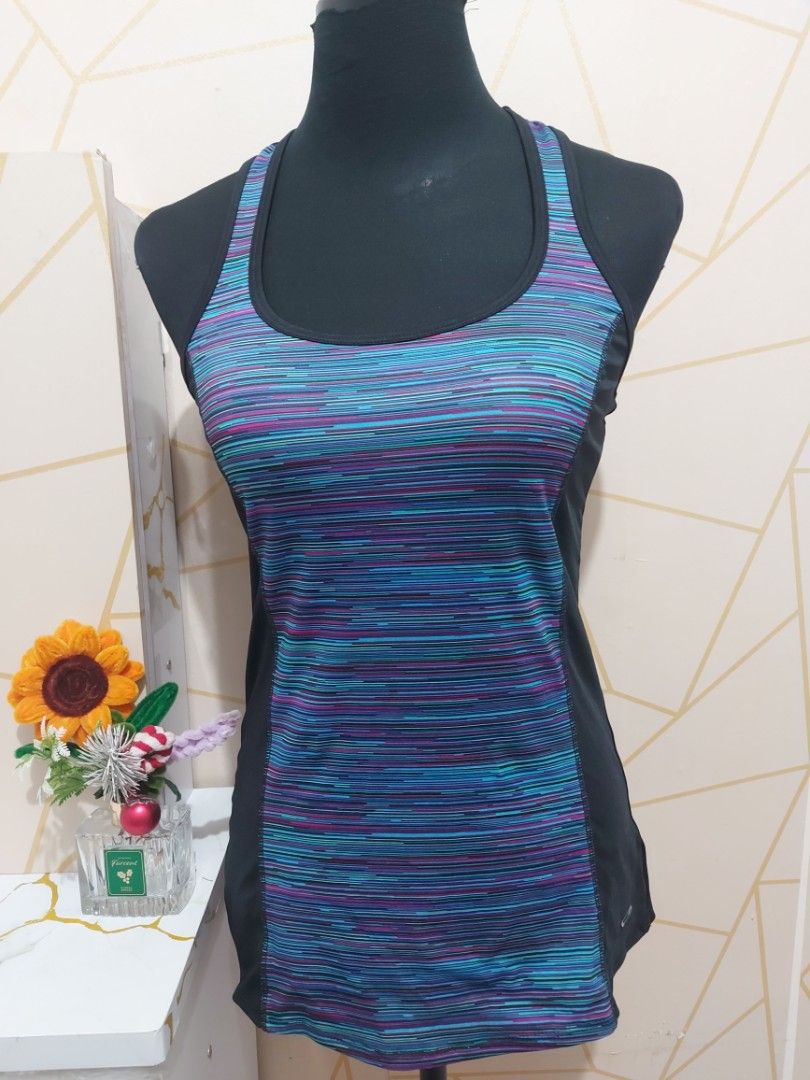 Workout Racerback Tank Top Multi-color Size S (Category: Activewear) located in Manila. Submitted by jollyann_b1990 (Listing ID 1466295966, Image 3). Description: - Multi-colored striped front panel with solid black sides and back - Racerback cut for full range of motion during workouts - Lightweight, breathable athletic fabric - Pairs great with black leggings - Ideal for the gym and active wear -size:Xs.