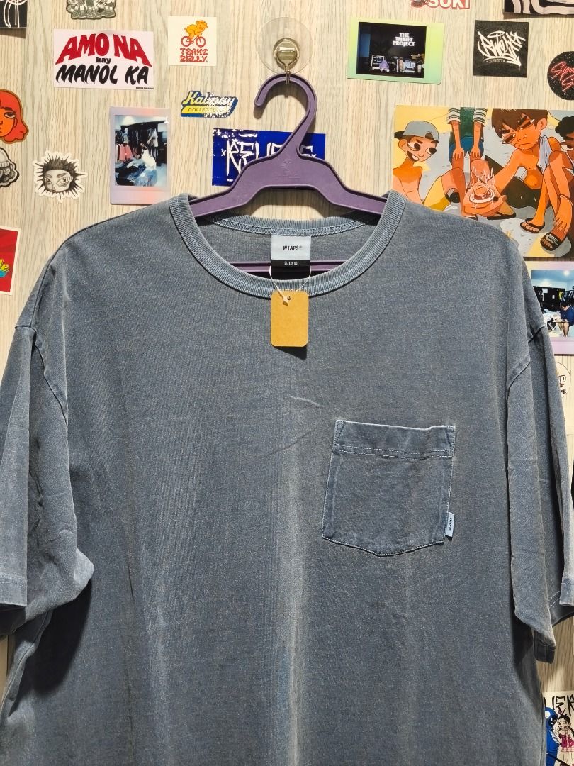 WTAPS Pocket T-Shirt (Category: Tshirts & Polo Shirts ) located in Davao. Submitted by thethriftproject082 (Listing ID 1466302774, Image 2). Description: WTAPS Pocket Tee 📍𝐌𝐈𝐍𝐄: 450 📍𝐒𝐈𝐙𝐄 𝐎𝐍 𝐓𝐀𝐆: 2XL 📍𝐃𝐈𝐌𝐄𝐒: 30 x 24 - Brand: WTAPS - Color: Washed Grey (faded vintage look) - Fit: Relaxed fit - Details: Crew neck, short sleeves, chest pocket with branding label, woven logo tag at the hem - Condition: Brand new / Excellent quali
