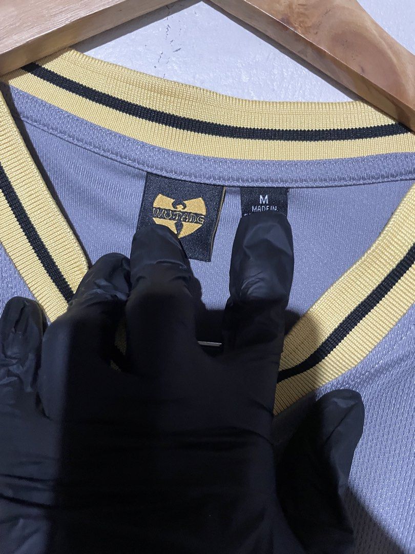 Wu-Tang Clan V-Neck Jersey (Category: Tshirts & Polo Shirts ) located in San Jose del Monte. Submitted by naaahmaaan (Listing ID 1466228167, Image 3). Description: - Dimes: L 28 - W 21 - Number 36 and text printed on the front - Large iconic Wu-Tang logo graphic on the back - Size: Medium - Condition: Excellent, - 📍Sjdm Bulacan Loc - Dm me for more inquiries 📩.
