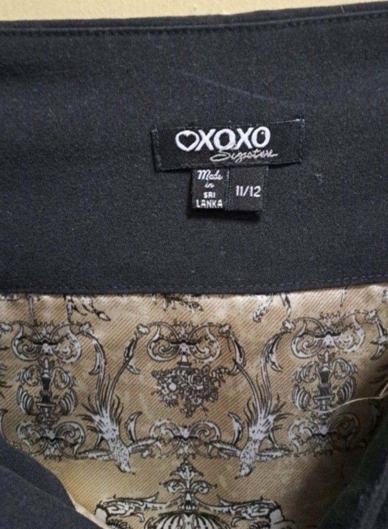 XOXO Black Pleated Skirt (Category: Skirts) located in Manila. Submitted by thrifter_lifestyle (Listing ID 1466178597, Image 2). Description: Brand: XOXO (bought in the US) Falls below the Knee- Length All Black with pleats Zipper enclosure on the side Has printed silk lining inside (see photo) Waist: 34" No issues 😀 RFS: Shifted to WFH, no need for office/business clothes.