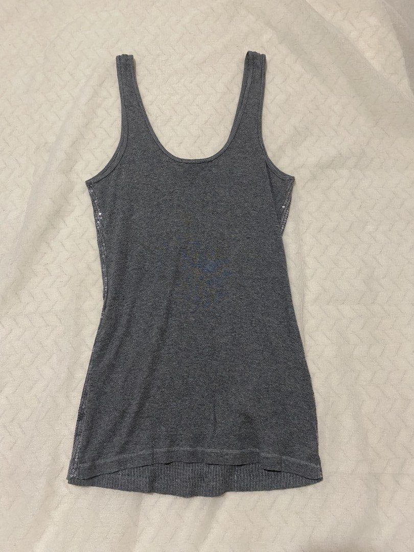 Y2k Express Sexy Basic Sequin Tank Top (Category: Sleeveless) located in Marilao. Submitted by kyssmarila (Listing ID 1466306292, Image 2). Description: — Size: M (stretchy) — Color: Silver colorway — Complete sequin — Flaws: None — Issue: None.