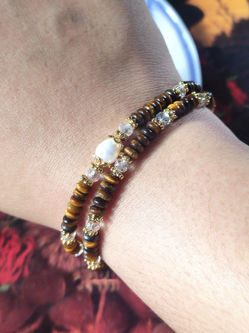 Yellow Tiger Eyes Abacus 3mm 2 Layer Bracelet (Category: Bracelets) located in Kinoguitan. Submitted by artemiscrystal (Listing ID 1466280702, Image 3). Description: - Two-layer handmade gemstone bracelet - 3mm yellow tiger eye abacus and faceted clear quartz stones - Elegant freshwater pearl accent - Gold-tone spacer beads - wrist size: 16cm - Made with natural stones.