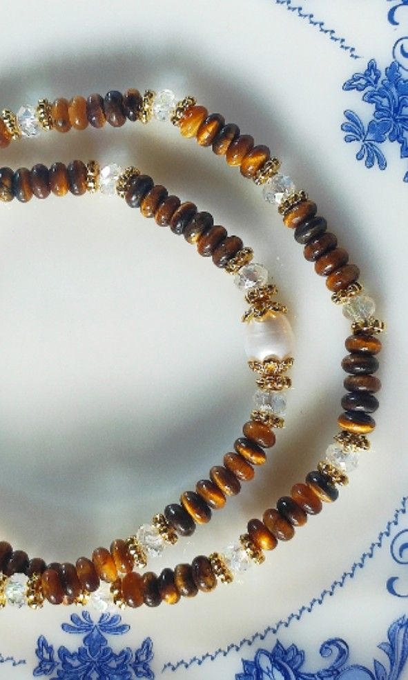 Yellow Tiger Eyes Abacus 3mm 2 Layer Bracelet (Category: Bracelets) located in Kinoguitan. Submitted by artemiscrystal (Listing ID 1466280702, Image 2). Description: - Two-layer handmade gemstone bracelet - 3mm yellow tiger eye abacus and faceted clear quartz stones - Elegant freshwater pearl accent - Gold-tone spacer beads - wrist size: 16cm - Made with natural stones.