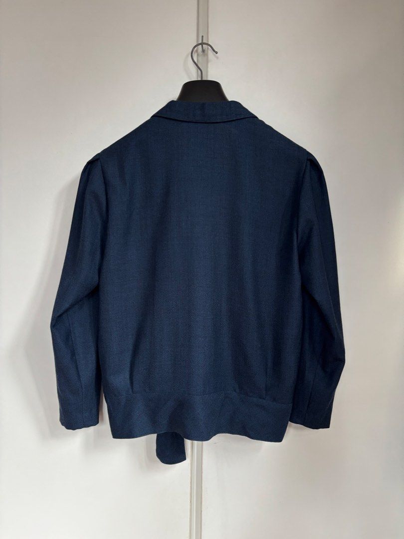 Yukiko Hanai Navy Wool Wrap Kimono Style Jacket (Category: Coats, Jackets and Outerwear) located in Paranaque City. Submitted by grailonious (Listing ID 1466288390, Image 2). Description: All measurements posted 8/10 super clean condition, but has tiny pinholes that aren’t noticeable Madame Hanai Yukiko wrap jacket in dark navy blue. Shawl collar neckline with long sleeves and light shoulder padding. Wrap front design secures with a side tie thro