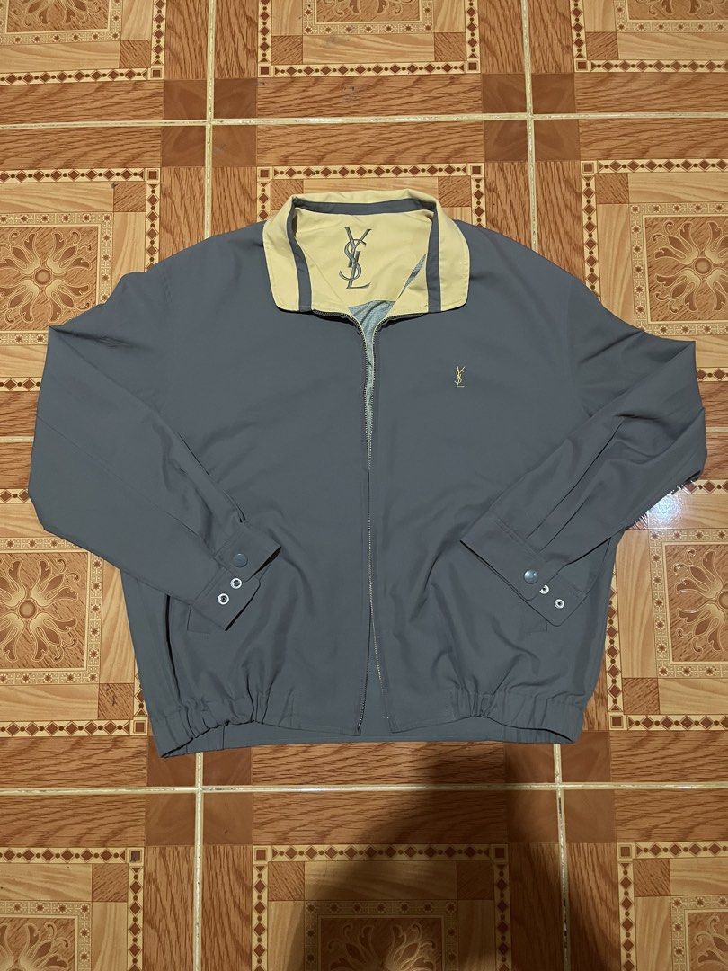 Yves Saint Laurent 90s YSL Logo Jacket (Category: Coats, Jackets and Outerwear) located in Kidapawan. Submitted by azythrift (Listing ID 1466270704, Image 3). Description: - Authentic vintage 90s Yves Saint Laurent designer piece - Size medium to large fittings - Issue missing puller the rest excellent - Classic grey body with contrast tan collar detailing - Small embroidered YSL monogram logo on the chest - Large YSL branding embroidered on the 