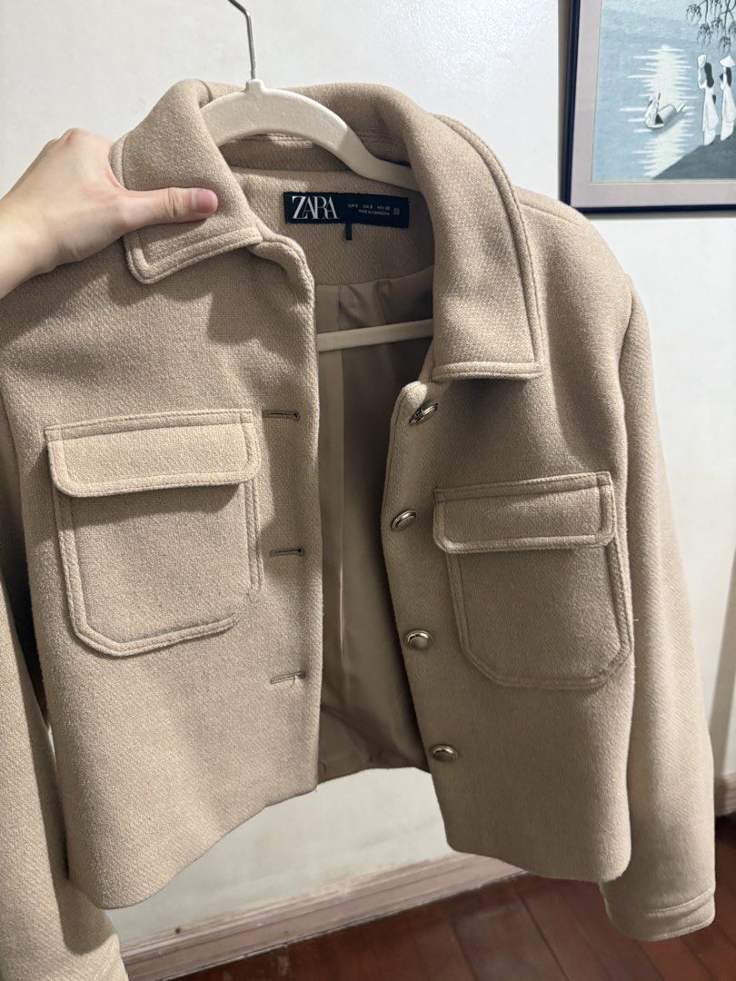 Zara Beige Wool Blend Cropped Jacket Size S (Category: Coats, Jackets and Outerwear) located in Pasay City. Submitted by anneeemariequa (Listing ID 1466268295, Image 1). Description: - Brand: Zara - Size: Small (S) - Color: Neutral beige - Material: Wool blend with smooth inner lining - Design: Cropped fit, button-up front, classic lapel collar, twin chest pockets - Condition: Clean, excellent, ready to wear - Style Tip: Versatile neutral piece t