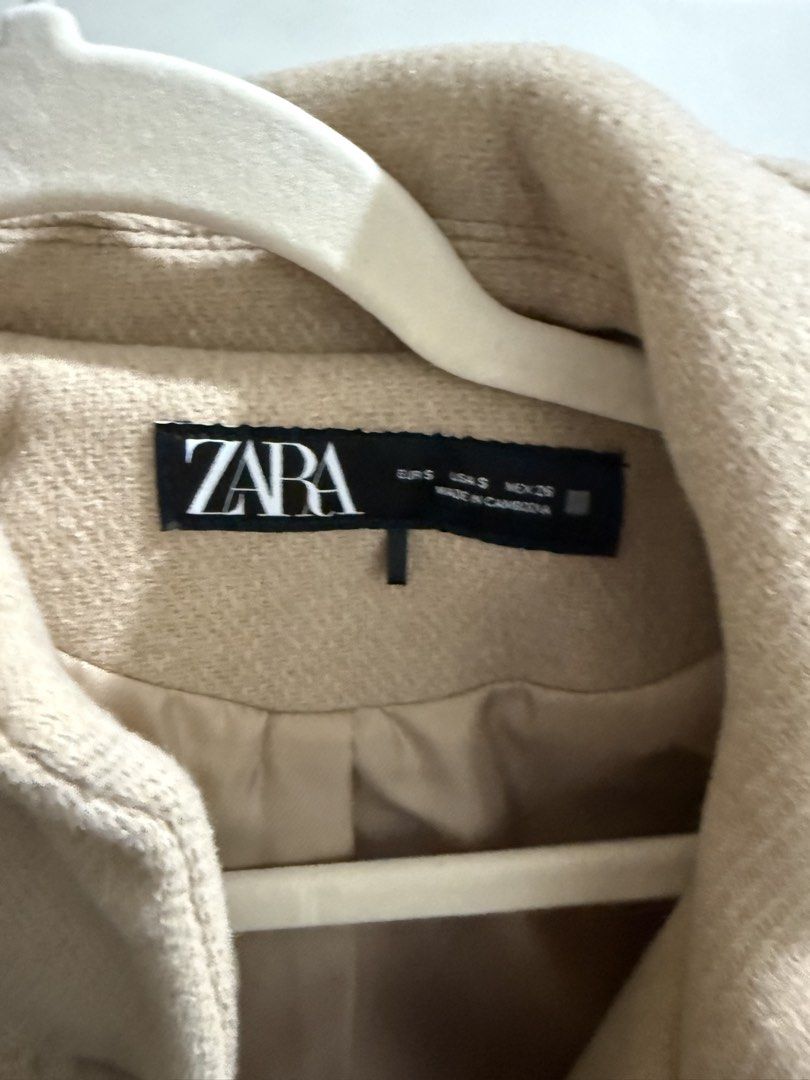 Zara Beige Wool Blend Cropped Jacket Size S (Category: Coats, Jackets and Outerwear) located in Pasay City. Submitted by anneeemariequa (Listing ID 1466268295, Image 2). Description: - Brand: Zara - Size: Small (S) - Color: Neutral beige - Material: Wool blend with smooth inner lining - Design: Cropped fit, button-up front, classic lapel collar, twin chest pockets - Condition: Clean, excellent, ready to wear - Style Tip: Versatile neutral piece t