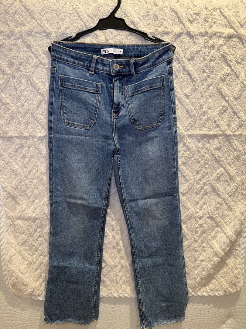 Zara Denim Jeans Blue Patch Pockets Raw Hem (Category: Jeans) located in San Juan City. Submitted by ich711 (Listing ID 1466272334, Image 1). Description: - Brand: Zara - Wash: Mid-blue - Fit: Straight leg, standard waist - Details: Two front patch pockets, raw fringe hem at ankles, metal button closure, belt loops - Condition: Excellent, clean with no flaws - Style: Versatile basic for daily rotation.