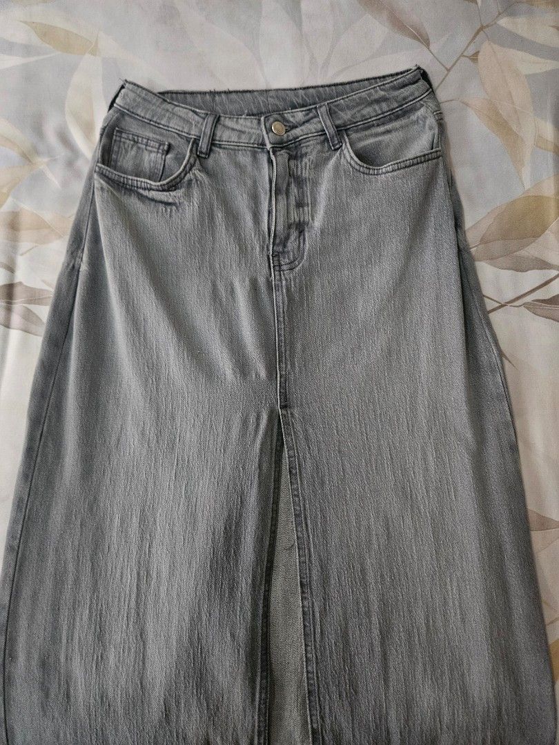 Zara Denim Midi Skirt (Category: Skirts) located in Muntinlupa City. Submitted by theasells (Listing ID 1466156907, Image 1). Description: Grey Zara denim midi skirt in a washed finish. Features a front slit. High-quality and thick material! Only used once.