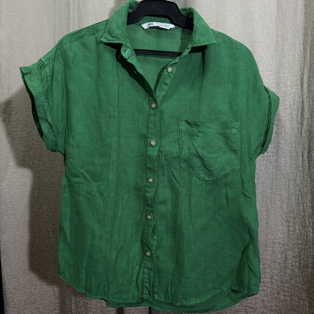 Zara Green Linen Short Sleeve Shirt (Category: Shirts) located in Manila. Submitted by she_alice (Listing ID 1466326310, Image 2). Description: - Brand: Zara - Size: XS but runs big (can fit up to medium) - Material: Lightweight linen - Color: Bright green - Details: Short cuffed sleeves, classic collar, left chest pocket - Origin: Made in Morocco - Condition: Excellent, no noticeable signs of use. 💬 Feel free to message me for any questions 🛵 
