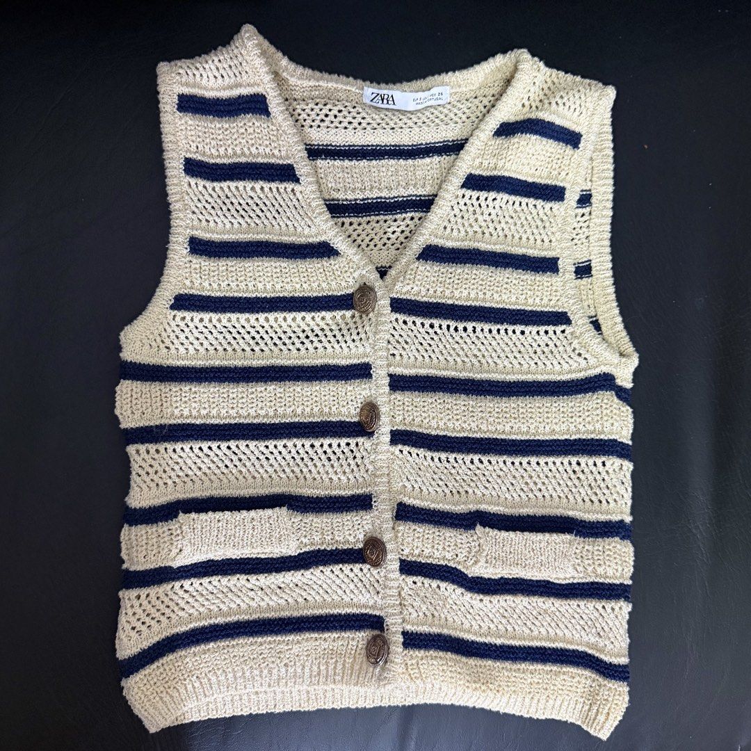 Zara Striped Knit Vest (Category: Sleeveless) located in Manila. Submitted by she_alice (Listing ID 1466326935, Image 2). Description: - Brand: Zara - Style: Beige and dark blue striped knitted vest with V-neck, front button closure, and two front pockets - Details: Breathable open-knit pattern, thick material - Size: S - Condition: Excellent -Super pretty in actual✨ 💬 Feel free to message me for any questions 🛵 Can be shipped via Lalamove .