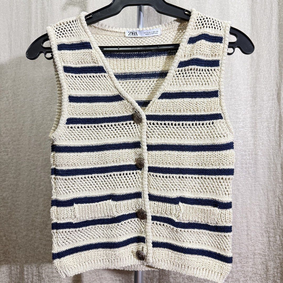 Zara Striped Knit Vest (Category: Sleeveless) located in Manila. Submitted by she_alice (Listing ID 1466326935, Image 1). Description: - Brand: Zara - Style: Beige and dark blue striped knitted vest with V-neck, front button closure, and two front pockets - Details: Breathable open-knit pattern, thick material - Size: S - Condition: Excellent -Super pretty in actual✨ 💬 Feel free to message me for any questions 🛵 Can be shipped via Lalamove .