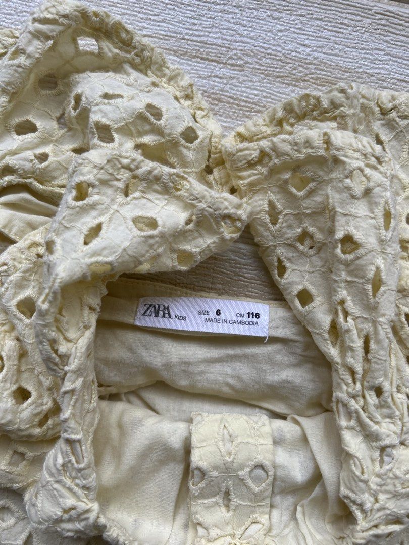 Zara top 6T (Category: Babies & Kids Fashion) located in Cebu City. Submitted by yjainani (Listing ID 1466170316, Image 3). Description: light yellow embroidered top from Zara featuring charming ruffled flutter sleeves and a square neckline.