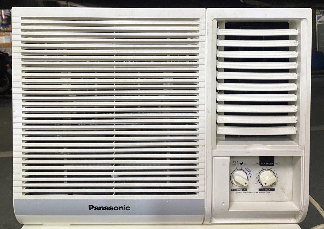 1HP Panasonic R32 Window Type Air Conditioner (Category: Air Conditioning and Heating) located in Manila. Submitted by almira_03 (Listing ID 1466549368, Image 1). Description: - Brand: Panasonic window-type air conditioner - Color: Clean white casing, ready for immediate installation - Controls: Dual rotary knobs for thermostat and timer settings with a manual operation panel - Airflow: Front louver design with adjustable vents - Performance: Coo