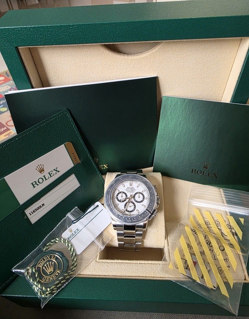 2019 Unpolished Local AD Rolex Daytona Panda 116500ln WITH WHITE TAG (Category: Watches) located in Singapore. Submitted by ken8366 (Listing ID 1465057153, Image 3). Description: - Model: 2019 Unpolished Rolex Daytona Chronograph with WHITE TAG COMPLETE FULL SET - Dial: White with three black sub-dials - Bezel: Black tachymeter bezel - Material: Stainless steel construction - Bracelet: Metal link bracelet with Oysterlock clasp and coronet logo - 