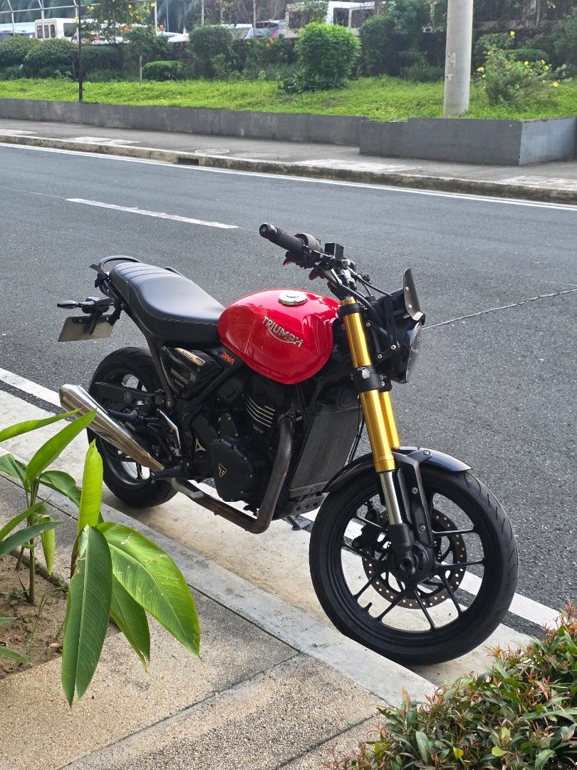 2024 Triumph Speed 400 (Category: Motorbikes for Sale) located in Pasay City. Submitted by dclutterco (Listing ID 1466387771, Image 2). Description: Posting for a friend FOR SALE 215k asking price. Slight Nego. Triumph Speed 400 2024 model 95xx kms ODO as of OCT 2026 OR/CR under my name Ferrari red color gas tank wrapped by Dzone Wraps (stock red paint and stickers still existing under the wrap) with bar end weights will include stock side mirror