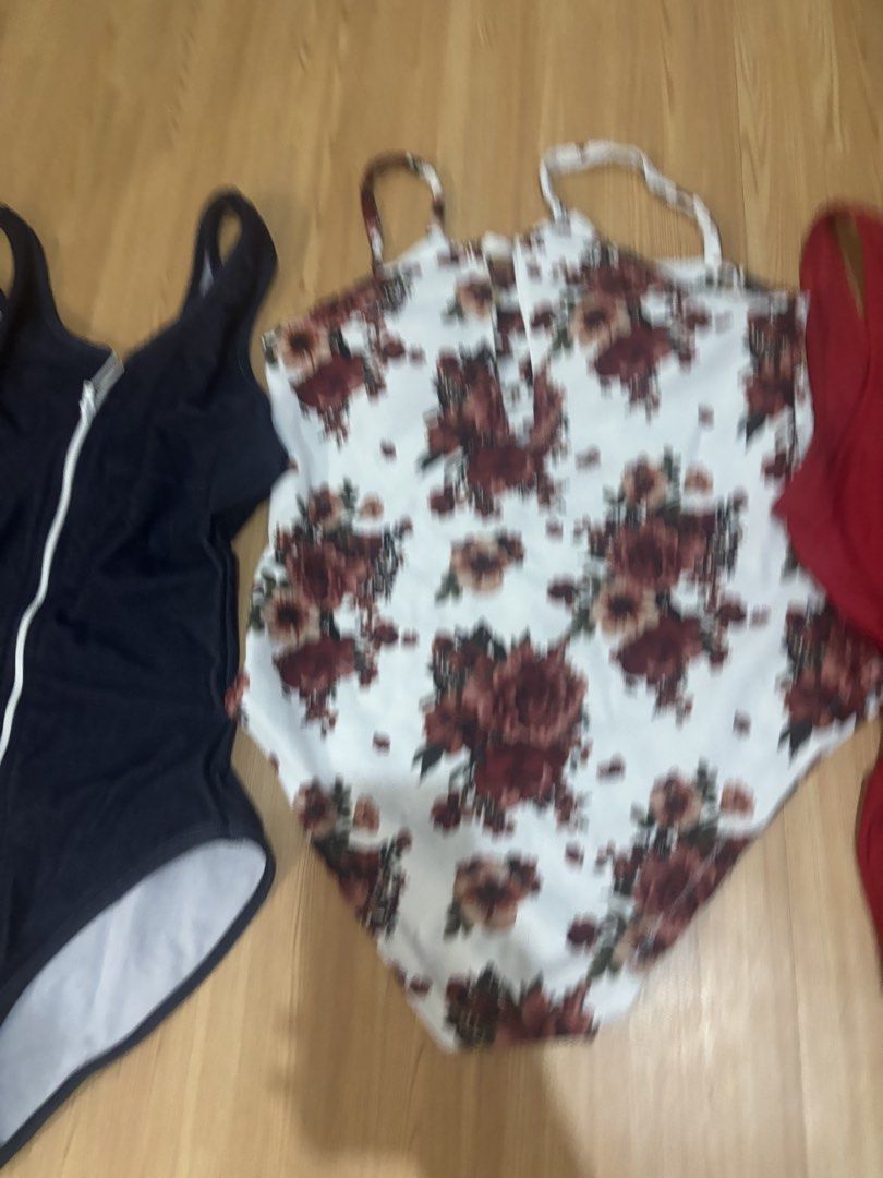 5 swimsuit TAKE ALL! (Category: Bikinis & Swimsuits) located in Manila. Submitted by jobithings (Listing ID 1466443737, Image 2). Description: - 4-piece women's swimsuit bundle - White one-piece with red floral pattern and front keyhole cutout - Solid red scoop neck one-piece - Black zippered one-piece with a denim-look finish - Two-piece set featuring a ribbed pink top and matching tie-side bottoms - Clean, well-maintained, and ready to wear - P
