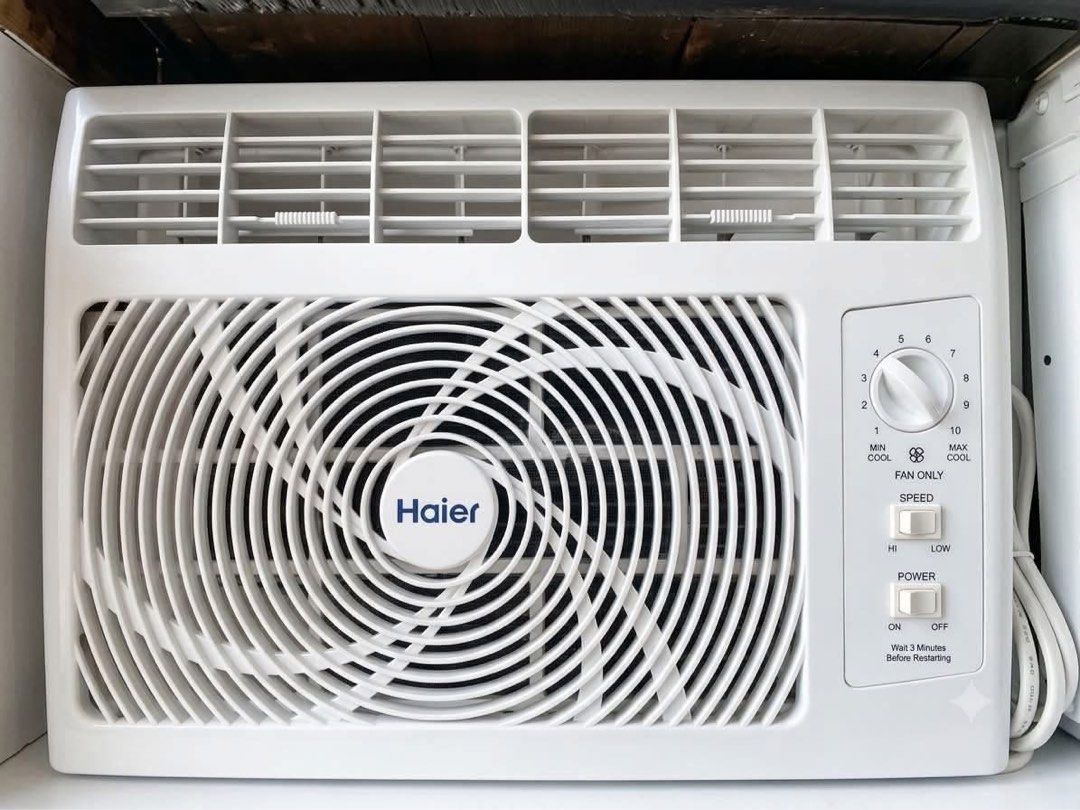 .5HP Haier Window Air Conditioner Unit (Category: Air Conditioning and Heating) located in Manila. Submitted by almira_03 (Listing ID 1466549632, Image 1). Description: - Brand: Haier Window Air Conditioner - Color: Clean white plastic housing with stylish front circular grille - Temperature Control: Manual dial ranging from settings 1 to 10 - Modes: Fan-only mode and dual speed settings (High and Low) - Power: Standard power cord attached on the
