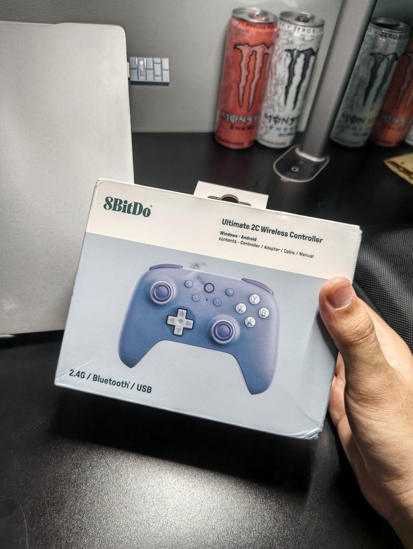 8BitDo Ultimate 2C Wireless Controller (Category: Controllers) located in Bangi. Submitted by nzzrre (Listing ID 1466371425, Image 3). Description: - Model: 8BitDo Ultimate 2C Wireless Controller (Blue) - Compatibility: Windows and Android (2.4G, Bluetooth, or USB) - Condition: Clean and fully working - Included: Original packaging box, matching hard storage case, charging cable, and brick-pattern wireless adapter - Extras: Joystick thumb grips a