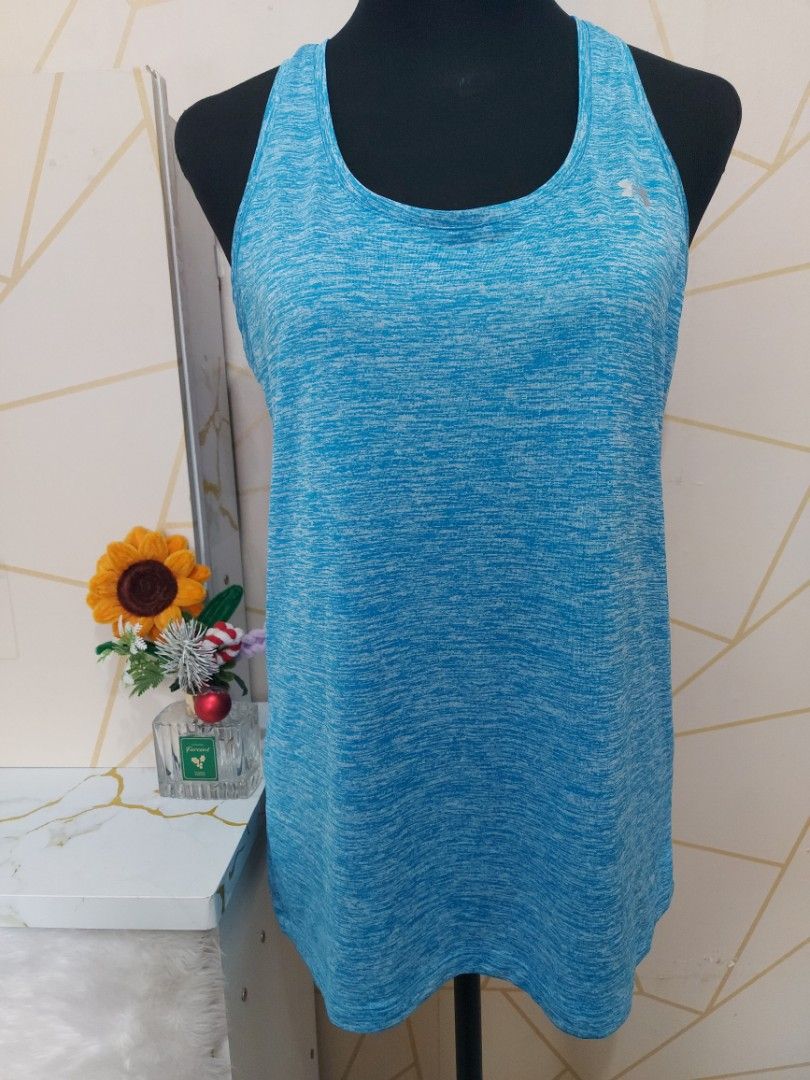 💙 Under Armour Heather Blue Tank - LONG VERSION (Category: Activewear) located in Manila. Submitted by jollyann_b1990 (Listing ID 1466417411, Image 3). Description: Size: M (oversized fit, can fit Large) Length: Long / tunic - pang cover ng puwet pag naka leggings! Condition: 9.5/10 No flaws, like new Fabric: Drifit / breathable / stretchy / heather texture Details: Small UA logo front + oval UA logo sa likod, racerback Best seller color! Fresh 