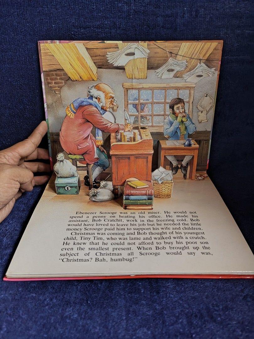 A Christmas Carol A Pop-Up Book (Category: Children's Books) located in Aroroy. Submitted by epicbird-0daf (Listing ID 1466414491, Image 2). Description: - Classic Charles Dickens story in a gorgeous 3D pop-up edition - Beautifully illustrated by John Patience featuring Scrooge, Bob Cratchit, Marley, and the spirits - Interactive movable paper engineering on multiple spreads - Perfect for festive family reading or holiday book collecting - Condit