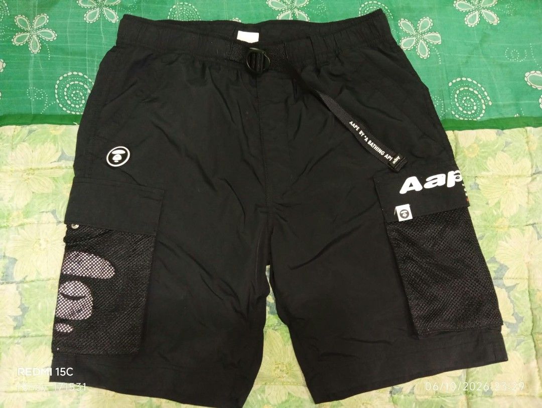 Aape By A Bathing Ape Black Cargo Shorts (Category: Shorts) located in Manila. Submitted by rms.thrift (Listing ID 1466456632, Image 1). Description: Good condition issue:minimal scratch sa print 9.5/10 color rate dimes : 34-37 adjustable waist x 24 width .