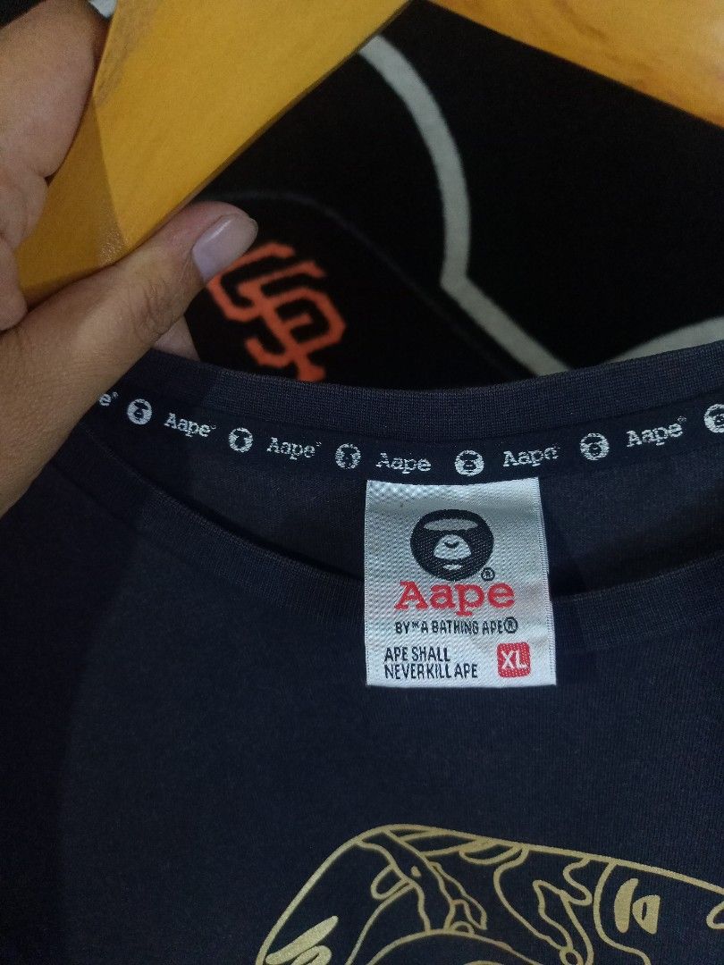 Aape By A Bathing Ape Black Tee (Category: Tshirts & Polo Shirts ) located in Castilla. Submitted by stignapamorma (Listing ID 1466478319, Image 3). Description: Size - 19.5x27 Condition - Excellent Color Rate - 8.5/10 Issue - Good Fade / Minimal Cracks Price - 400+SF.