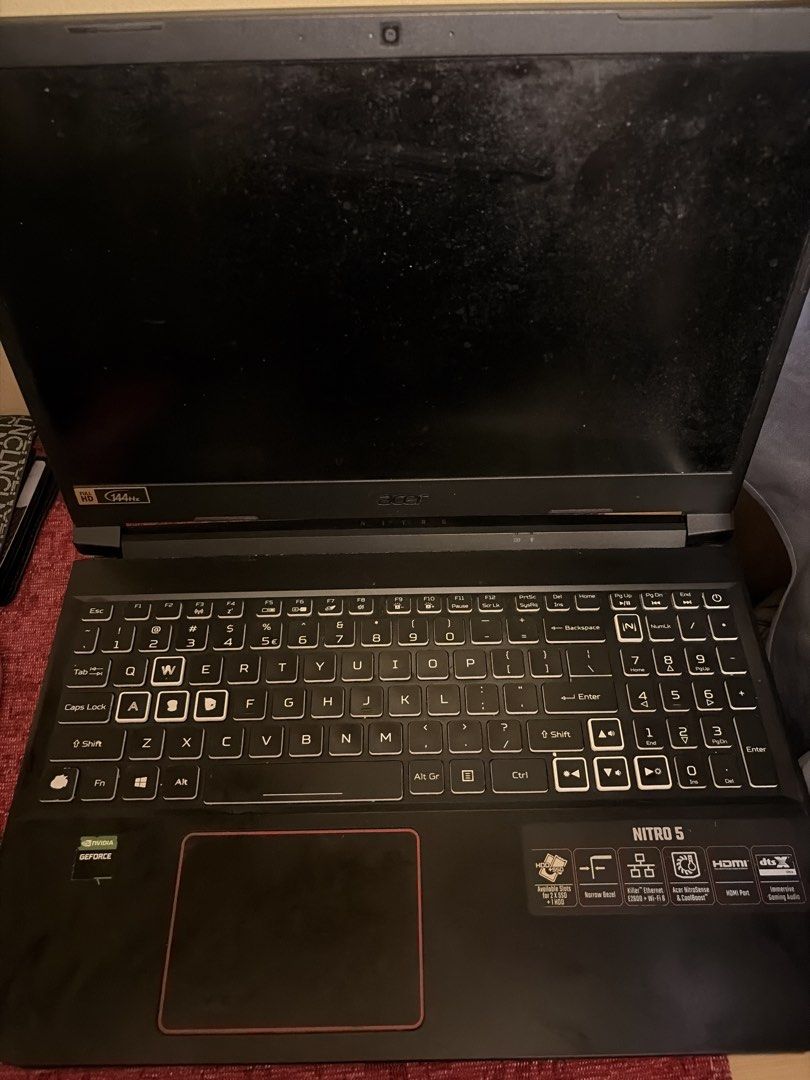 Acer Nitro 5 Gaming Laptop (Category: Laptops & Notebooks) located in Pasig City. Submitted by charlsmcdizz (Listing ID 1466358103, Image 2). Description: Acer Nitro 5 gaming laptop running Windows. Intel i5-10300H processor, NVIDIA GeForce RTX 2060 graphics card, 8GB RAM, and 1.38TB total storage. 144Hz Full HD screen. Backlit keyboard with numpad. Ports include HDMI and Ethernet. Shows dust and minor smudges on the chassis and screen, overall n