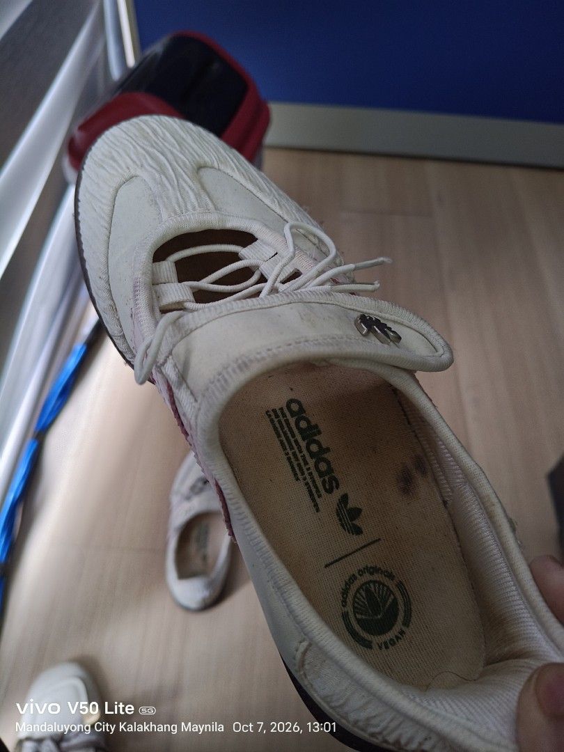 Adidas and Xtep Sneaker Bundle (Category: Sneakers) located in Manila. Submitted by prettylook48762 (Listing ID 1466385532, Image 3). Description: - Sneaker bundle deal (2 pairs for 1 price) - Pair 1: White Adidas vegan slip-ons with textured uppers - Pair 2: Pink and grey Xtep laced running shoes - Size: US 6 / UK 3.5 / EUR 36 (applicable to both or general bundle size) - Condition: Visible signs of wear, with dirt on soles and insoles - Perfect